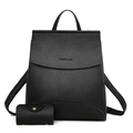 Chic black pebbled leather backpack set with top handle and matching coin purse on white background - Black