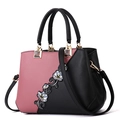 Pink and black color-block handbag with floral embroidery and hanging fur ball detail - Classic / Pink