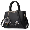 Black faux leather tote with floral embroidery, gold metal bar, and grey pom-pom charm - Double Flower Decor Style / Black
