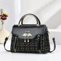 Elegant black tweed and leather handbag with golden swan clasp and pearl detail - Black
