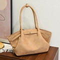 Large capacity camel suede tote bag with metal square buckle in minimalist home setting - Khaki