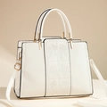 Elegant white faux leather handbag featuring 3D rose embroidery and gold hardware - White