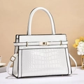 Detail of white crocodile embossed leather bag with gold buckle and smooth strap texture - White