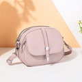 Chic light purple textured leather crossbody bag with three zip pockets and flap detail - Pink