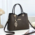 Brown vintage monogram handbag for women with gold hardware and pearl leaf charm - Coffee