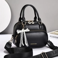 Chic black PU leather handbag with gold zipper and elegant pearl lace bow charm detail - Black