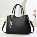 Classic black litchi texture handbag with gold hardware and musical note tassel decoration - Black