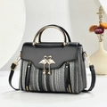 Chic multicolor woven shoulder bag with golden swan closure and elegant pearl tassel - Black