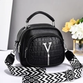 Black faux leather handbag with crocodile texture and geometric shoulder strap - Black