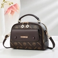 Vintage brown monogram handbag with gold hardware and logo in 45-degree studio view - Coffee