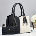 Fashionable black and white striped tote bag with matching small clutch and gold hardware - Black and White