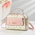 Elegant cream and pink monogram handbag with gold hardware and adjustable strap - White and Pink