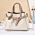 Chic multi-layer beige crossbody bag with brown accents and plush charm accessory - Off White