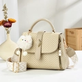 Khaki woven tote bag with beige strap and cute cat plush charm in a lifestyle setting - Khaki
