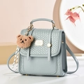 Minimalist light blue crossbody bag with woven texture and cute teddy bear charm - Woven Style / Teal