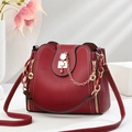 Deep red bucket bag with cat-shaped gold lock and adjustable shoulder strap on white background - 22*10*20CM / Cat's Eye Wine Red