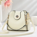 Creamy white bucket bag with gold clover lock and textured leather from a front view - 22*10*20CM / Clover Off-white