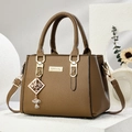Brown lychee grain leather tote bag with gold hardware on a modern display stand - Diamond Style/Khaki
