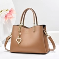 Brown leather handbag with gold heart pearl charm and adjustable shoulder strap - Khaki
