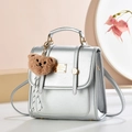 Silver metallic mini backpack with gold logo plate and cute brown plush bear charm - Solid Color / Silver