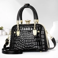 Elegant black shell bag with shiny crocodile pattern and gold hardware handles - Black