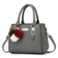 Deep grey litchi grain leather handbag with gold logo and plush pompom charm - Three-Ball Pendant/Dark Gray