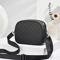 Quilted black nylon crossbody bag with three zip layers on a minimalist white platform - Gunmetal Hardware Quilted