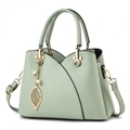 Light green litchi grain handbag with gold V-shaped detail and pearl leaf pendant - Green