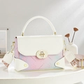 Chic floral gradient shoulder bag with golden lock and wide artistic strap on a table - Off White
