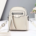 Chic beige crossbody bag with lychee grain texture and trendy tassel details for women - Vertical / White