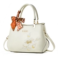 Elegant off-white embroidered handbag with floral pattern and silk scarf handle - Off-white/Plum Blossom