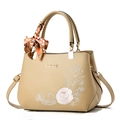 Elegant beige embroidered handbag with floral patterns, top handle, and scarf detail - Khaki/Rose