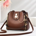 Brown litchi leather bucket bag featuring cat-shaped metal buckle and gold chain - 22*10*20CM / Cat's Eye Brown