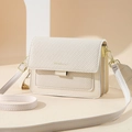 Elegant beige flap shoulder bag with adjustable strap and golden hardware accents - Beige