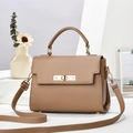 Elegant brown pebbled leather trapezoid handbag with gold hardware on a minimalist display - 24*11*17CM / Khaki