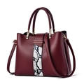 Burgundy lychee pattern handbag with snakeskin stitching and golden hardware - Burgundy