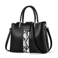 Black leather handbag with snakeskin pattern and gold hardware on white background - Black
