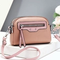 Pink lychee grain leather crossbody bag with double zippers and stylish tassel detail - Horizontal / Pink