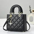 Klassische schwarze Stepptasche mit goldenem Griff und Stern-Anhänger für Damen - Schwarz / Sternenstil