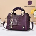 Deep purple crocodile pattern crossbody bag with golden hardware and flower accents - L23 W10 H18 / Purple