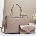 Detail of faux crocodile leather tote and envelope bag set with golden metal hardware - Khaki