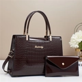 Detail of dark brown crocodile texture tote bag with golden Danbaoly logo and matching pouch - Coffee