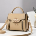 Elegant beige crossbody bag with swan metal buckle and decorative side zippers - Khaki