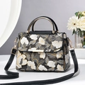 Sac à main élégant à imprimé floral avec poignées dorées et bandoulière en cuir - Noir