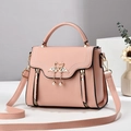 Pink lychee texture crossbody bag featuring double swan buckle and pearl pendants - 23cm x 18cm x 11cm / Pink