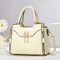 Minimalist beige crossbody bag with golden swan charm and pearl tassel for women - L24 W12 H20cm / Off-white