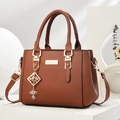 Dark brown lychee texture handbag with gold charms and adjustable shoulder strap - Diamond Style/Earth Yellow