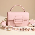Pink top-handle handbag with large decorative buckle and embroidered ethnic shoulder strap - Pink