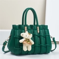 Detail of dark green woven leather handbag with gold hardware and white bear charm - 28*14*18CM / Green