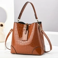 Brown crocodile embossed patent leather bucket bag with gold hardware and top handle - Khaki/Earth Yellow
